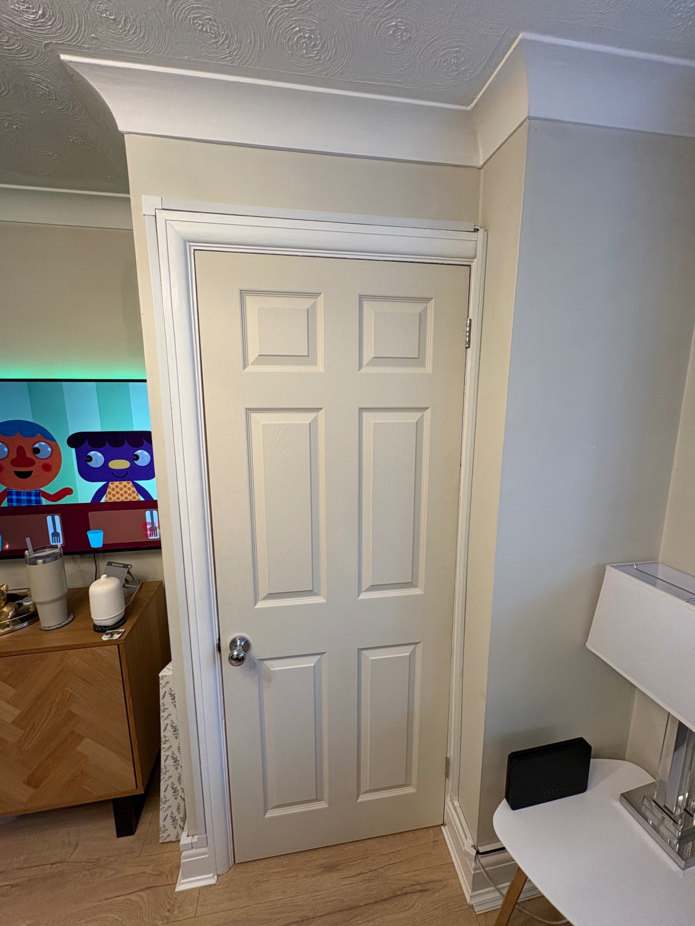 Traditional white six-panel internal door installed in a living space